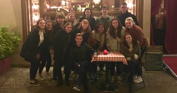 The Berlin students pose for a group picture with their professor in front of a restaurant in Germany.