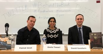 Patrick Verel, Geeta Tewari and David Goodwin sit at a table at Fordham School of Law