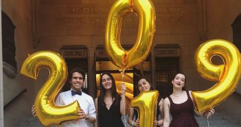 students holding balloons that say 2019