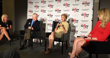 Christine Driessen, Tim McCarver, Jane Pauley and Sarah Kugal, seated in front of a WFUV step and repeat banner