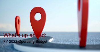An oversized red location logo above the words "What's up ahead: FY 2022 Operating Budget"
