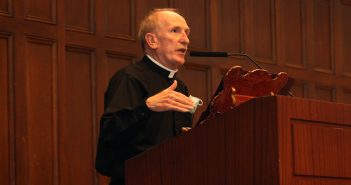 Father McShane delievers the 2021 State of the University address at a wood podium