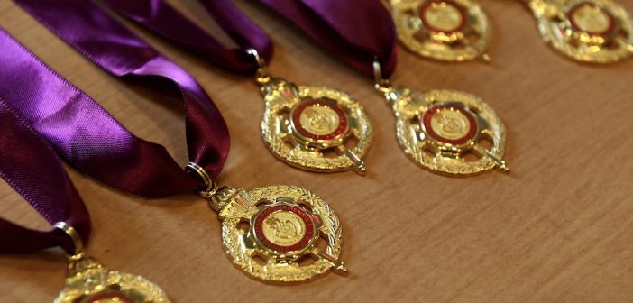 A group of medals on a table.