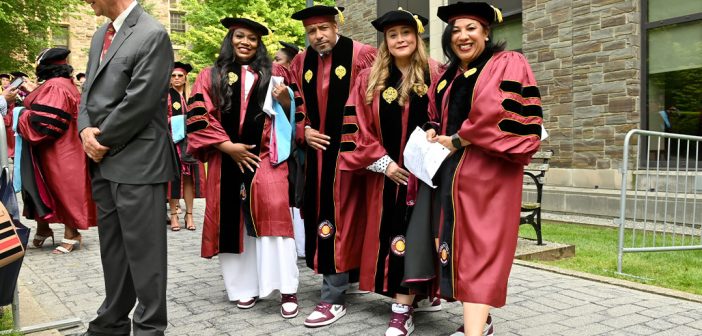 GSE graduates posing with matching sneakers